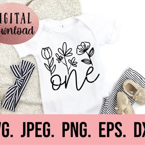 May include: A white onesie with a black floral design and the word "one" in a cursive font.