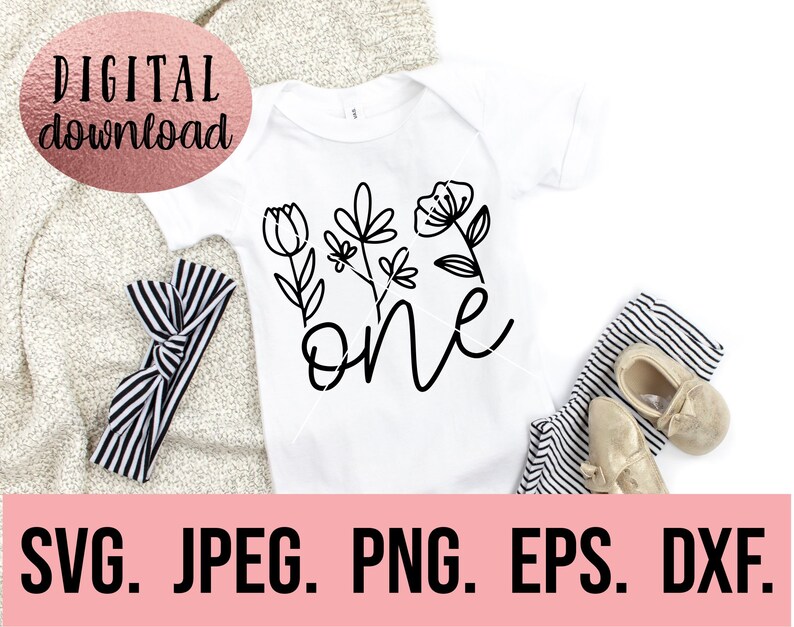 May include: A white onesie with a black floral design and the word "one" in a cursive font.