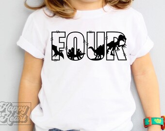 May include: White t-shirt with the word "FOUR" in large black letters. Silhouettes of dinosaurs are incorporated into the letters. The shirt is being worn by a child. A colorful bracelet is on the child's wrist.