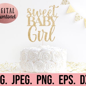 May include: Gold glitter cake topper with the text "sweet baby girl" on a white cake with white frosting.