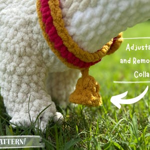May include: Close-up of a white, textured, crocheted llama or alpaca leg with an adjustable and removable collar. The collar is yellow, red, and gold. The text "PATTERN!" is at the bottom.