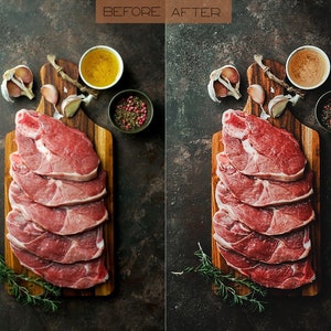 May include: Raw lamb chops on a wooden chopping board with garlic cloves, rosemary sprigs, and peppercorns. The lamb is arranged in a stack, with the fat side facing up.