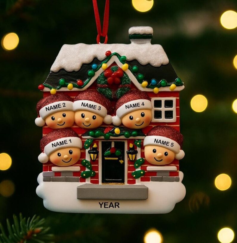 May include: A personalized Christmas ornament shaped like a house, featuring five smiling faces wearing Santa hats. The house is red with white snow accents, a black roof, and a small window. Each hat has a name on it. The word "YEAR" is at the bottom.