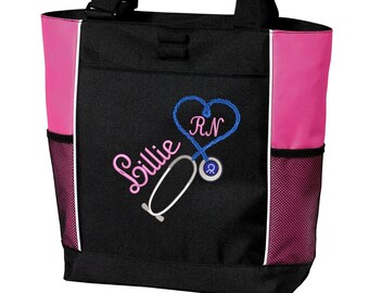 May include: Black tote bag with pink accents and a white embroidered stethoscope, heart, and the name "Lillie RN".