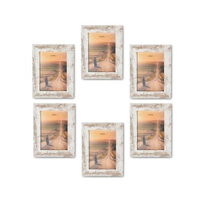 May include: Set of six whitewashed wood picture frames with a rustic distressed finish. Each frame features a landscape photograph of a dirt road leading to a horizon.