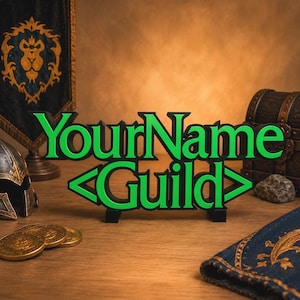 May include: A green and black sign that reads "YourName Guild" in a stylized font. The sign is on a wooden surface, with a banner, helmet, coins, and treasure chest in the background. The banner has a gold lion emblem.