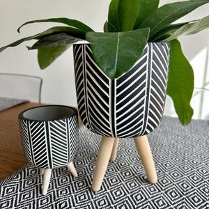 Herring Bone Cement Tripod Planter Pots on Wood Stands