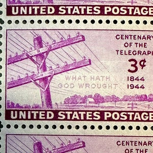 May include: A vintage United States postage stamp commemorating the 100th anniversary of the telegraph. The stamp features a purple illustration of a telegraph pole with wires and the text "Centenary of the Telegraph 3¢ 1844 1944 What Hath God Wrought".