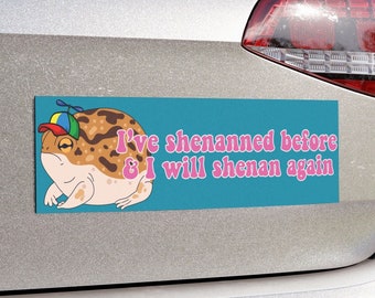May include: A blue bumper sticker with a cartoon frog wearing a hat. The text on the sticker reads "I've shennaned before & I will shenan again."