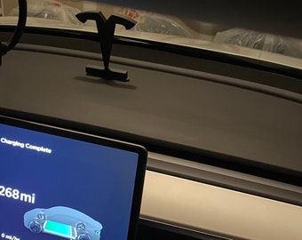 May include: A car dashboard screen displays "Charging Complete" with a range of 268 miles. The screen shows a car icon with a green battery bar indicating a full charge. The screen also shows 0 mi/hr, 0/8 A, and 2 V.