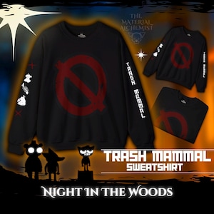 May include: Black sweatshirt with a red circle and a diagonal line through it. The text "Trash Mammal" is on the right sleeve. The text "Night in the Woods" is at the bottom of the image.