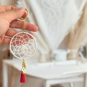 Piccolo portachiavi acchiappasogni blu con ciondoli malocchio e frange rosse, bomboniera personalizzata con ciondolo, regalo di fidanzamento, ordini all'ingrosso