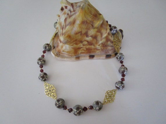 Large Polymer Clay Beads Surrounded by Crystals and Gold Findings