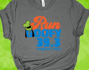May include: Gray t-shirt with a graphic of Goofy wearing a green hat and the text "Run Goofy 39.3 magical miles".