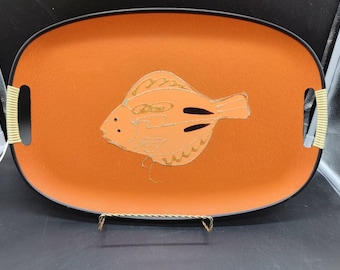 May include: Orange serving tray with black trim and gold accents. The tray features a stylized fish design.