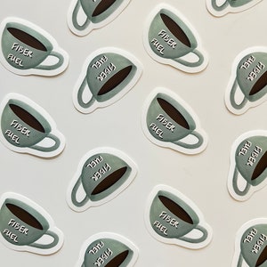 May include: Multiple stickers featuring a cartoon coffee cup with the text "Fiber Fuel" in a white font on a green background. The stickers are arranged in a grid pattern on a white surface.