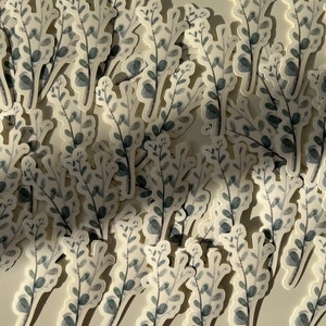 May include: A collection of gray and white watercolor stickers featuring a simple leafy design. The stickers are arranged in a random pattern on a white surface.