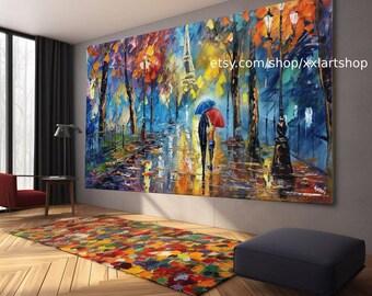 May include: A colourful oil painting depicting a couple walking under an umbrella in a Parisian street scene. The Eiffel Tower is visible in the background. The painting is framed and hanging on a wall in a modern living room.