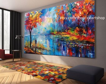 May include: A colourful abstract painting depicting a forest scene with a lake and a solitary figure standing by the water's edge. The painting is executed in a vibrant palette of blues, greens, yellows, and reds. The text "etsy.com/shop/xlartsshop" is visible in the top right corner of the painting.