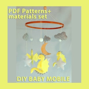 May include: DIY baby mobile kit with PDF patterns and materials. The mobile features a wooden ring, felt clouds, a crescent moon, stars, and a yellow dragon.