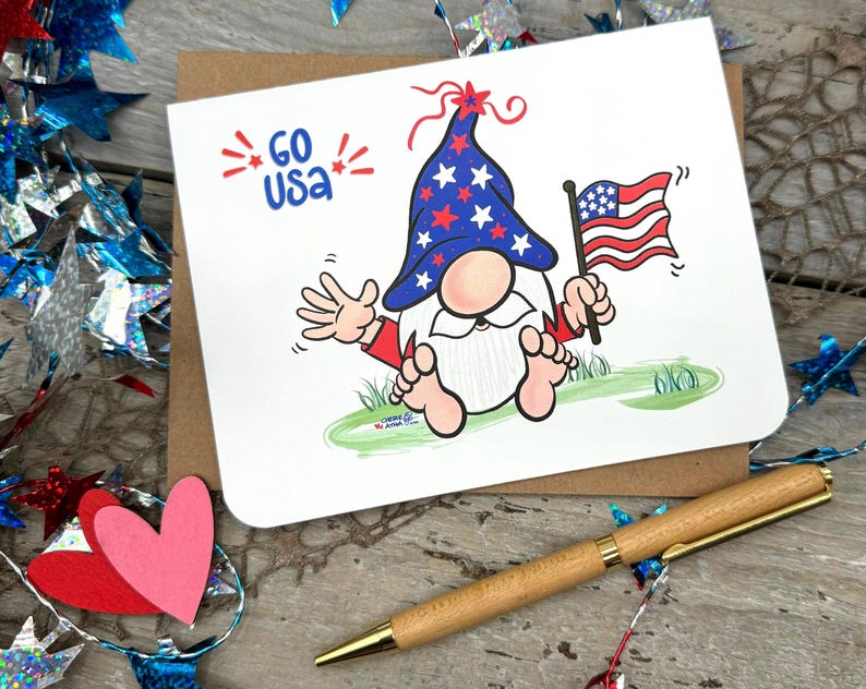 Celebrate American spirit with this delightful gnome card, displayed with the message GO USA and embellished with vibrant red starbursts. Perfect for showing your patriotism to friends during Labor Day or any special occasion!
