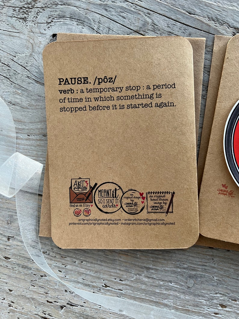Up close of the back of the pause button card