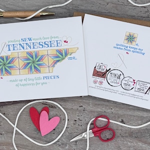 May include: A white card with a colorful illustration of the state of Tennessee made up of quilt squares. The text on the card reads "sending SEW much love from... TENNESSEE made up of tiny little PIECES of happiness for you." The back of the card has a colorful illustration of a quilt square and the text "quilting keeps my seams from splitting".