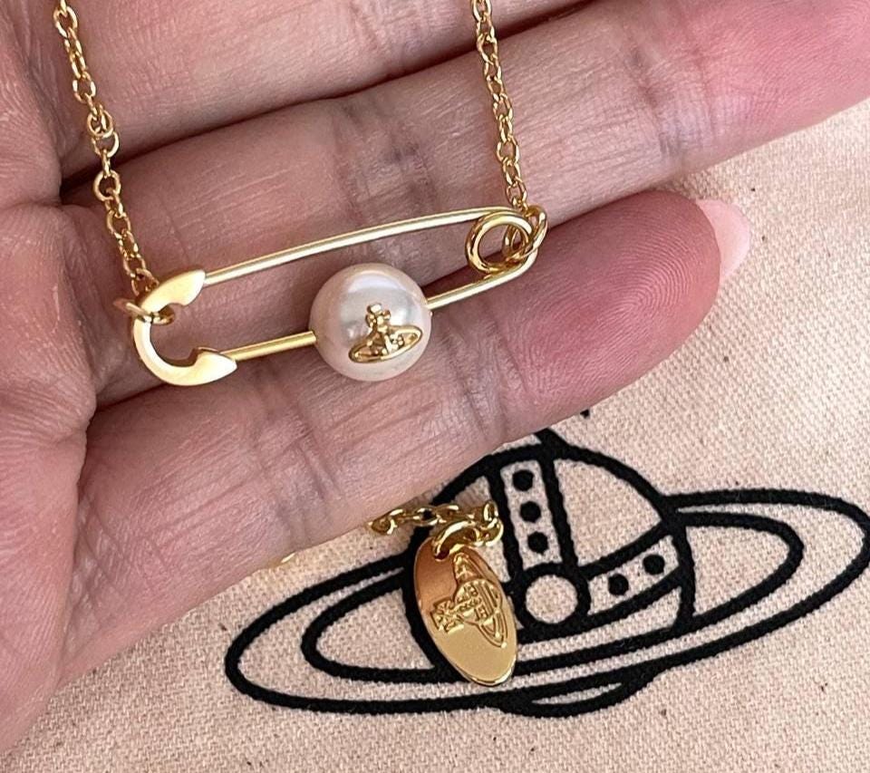 vintage silver saturn necklace, Vivienne Westwood pin pearl necklace