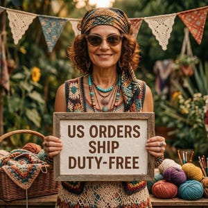May include: A woman wearing sunglasses, a headscarf, and a crochet vest holds a wooden sign with the text "US ORDERS SHIP DUTY-FREE". The background includes crochet banners, a basket, and colorful yarn, suggesting a craft or handmade goods theme.