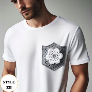 May include: White t-shirt with a gray crochet pocket featuring a white flower design. The shirt has short sleeves and a crew neck. The text "STYLE 538" is in a white circle in the lower left corner.