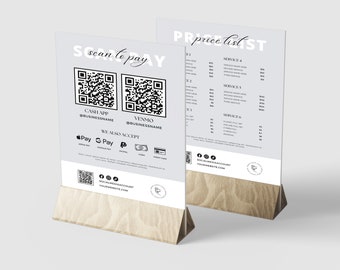 May include: A white sign with black text and a QR code for scanning to pay. The sign also lists the payment methods accepted, including Cash App, Venmo, Apple Pay, Google Pay, PayPal, and credit card. The sign is on a wooden stand.