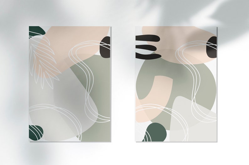 Puede incluir: Dos impresiones de arte abstracto con un esquema de color verde, blanco y rosa. Las impresiones presentan formas y l&iacute;neas org&aacute;nicas.