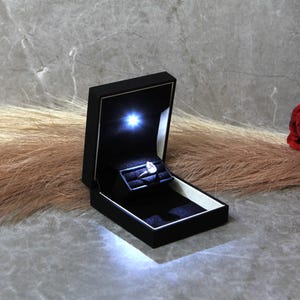 pocket sized engagement ring box with light