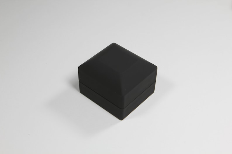 black engagement ring box with light