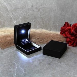 black proposal ring box with light