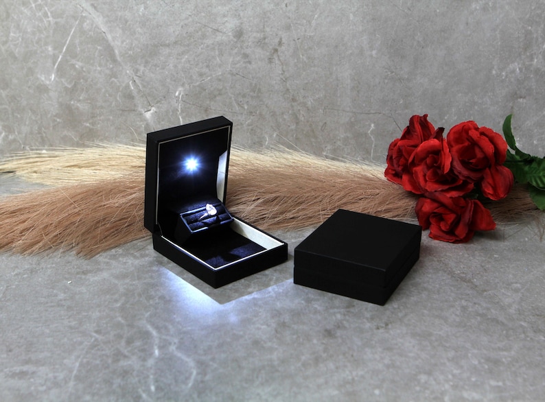 black proposal ring box with light