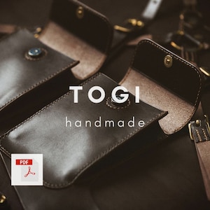 May include: Two brown leather phone cases with a brown leather strap. The cases are open and the inside is lined with a light brown fabric. The text "TOGI handmade" is printed on the front of the cases.