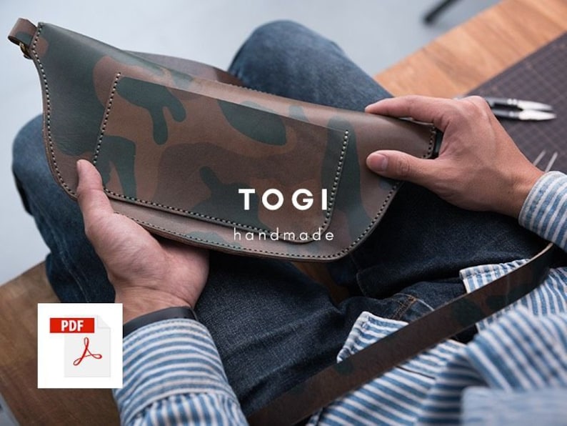 May include: A brown leather bag with a camouflage pattern. The bag has a flap with the text "TOGI handmade" on it. A PDF icon is in the lower left corner of the image.