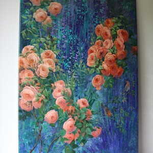 May include: A rectangular canvas painting featuring clusters of peach-colored roses with green leaves set against a deep blue and purple textured background. Two small birds are perched on thin branches among the flowers on the right side.
