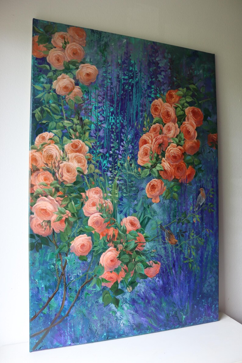 May include: A rectangular canvas painting featuring clusters of peach-colored roses with green leaves set against a deep blue and purple textured background. Two small birds are perched on thin branches among the flowers on the right side.