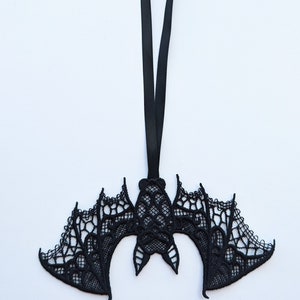 May include: Black lace bat ornament with a black ribbon for hanging.