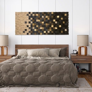 May include: A bedroom with a wooden bed frame and a brown blanket. There are two bedside tables with lamps and a large wooden wall art piece above the bed.