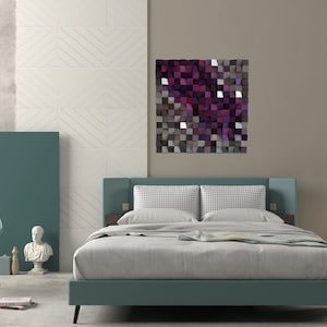 May include: A bedroom with a teal headboard and a bed with white bedding. A geometric wall art piece with shades of purple, gray, and white hangs on the wall behind the bed.