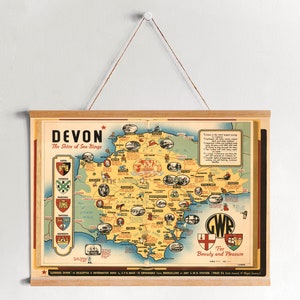 May include: A vintage travel poster for Devon, England, featuring a map of the region with illustrations of landmarks and attractions. The poster is titled "Devon, The Shire of Sea Kings" and includes the text "GWR For Beauty and Pleasure".