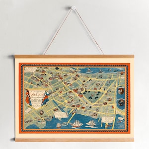 Könnte beinhalten: Eine vintage illustrierte Karte von Salem, Massachusetts, mit einem roten, weißen und blauen Rand. Die Karte zeigt die Straßen, Gebäude und Sehenswürdigkeiten der Stadt. Der Titel der Karte lautet "A Pictorial Map of Salem, Massachusetts".