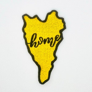 May include: Yellow embroidered patch in the shape of a state with the word "home" written in black cursive lettering.