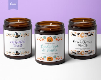 May include: Three Halloween-themed candles with brown glass jars and white labels. The labels feature illustrations of pumpkins, bats, and witches. The candle scents are Enchanted Forest, Candy Corn & Vanilla, and Black Cherry Merlot.
