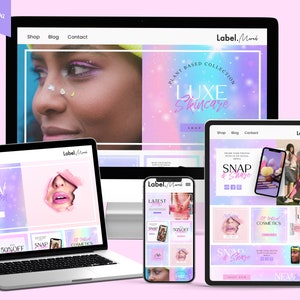 May include: A website homepage for a skincare brand called Label.Mork. The website features a pink and purple color scheme with a holographic effect. The website has a banner image with the text "Plant Based Collection Luxe Skincare Shop Now". The website also features a variety of other images, including a close-up of a woman's face, a variety of skincare products, and a group of people.