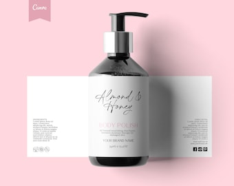 May include: A black bottle with a silver pump dispenser and a white label. The label says "Almond & Honey Body Polish" and includes the text "All Natural nourishing shea butter, intensive moisture therapy for damaged skin". The label also includes the brand name and the size of the bottle, 340g e 13.4oz.