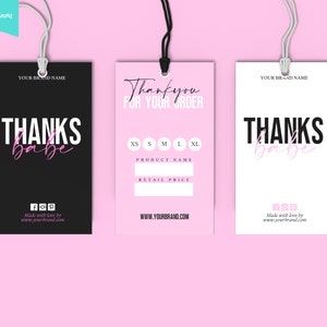 May include: Three clothing tags with white strings against a pink background. The tags are black, pink, and white, each with the words "THANKS babe" in a mix of bold and script fonts. The pink tag says "Thank you for your order".